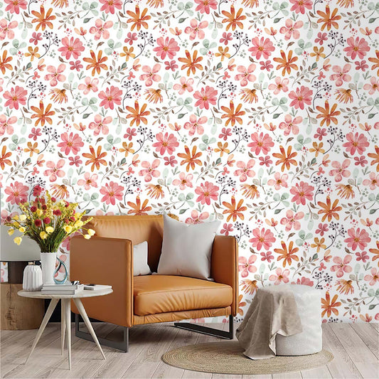 Rental living room makeover featuring removable floral peel and stick wallpaper, brown leather sofa, and decorative plants
