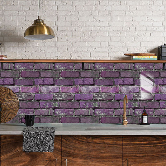 Kitchen with purple brick wall, wooden cabinets, and a white brick wall.